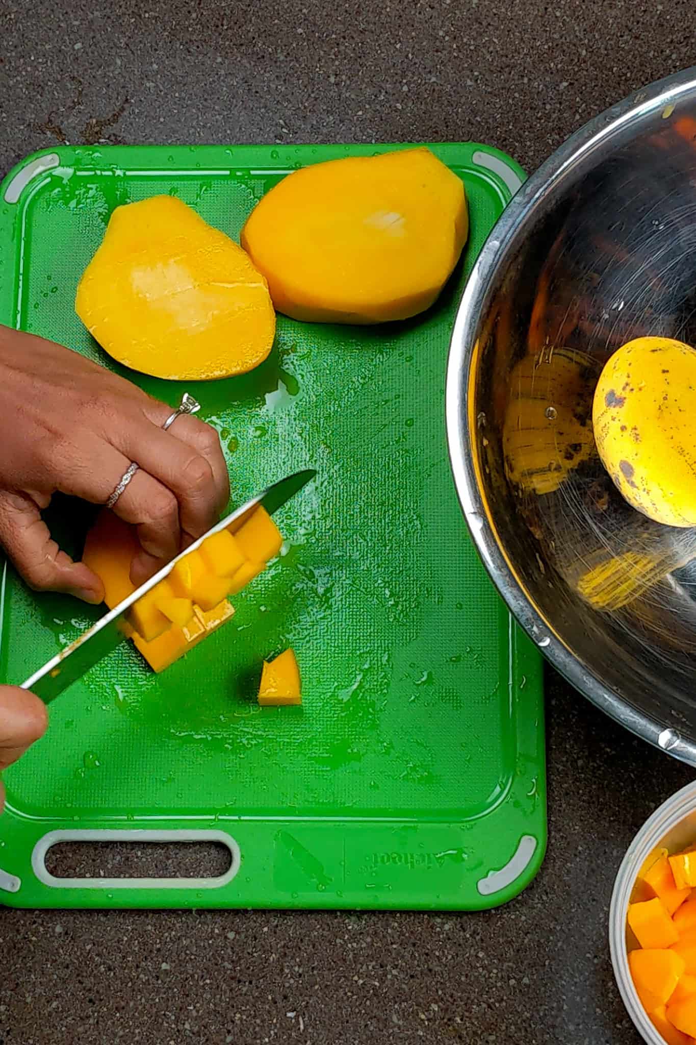 dicing the mango into even pieces.