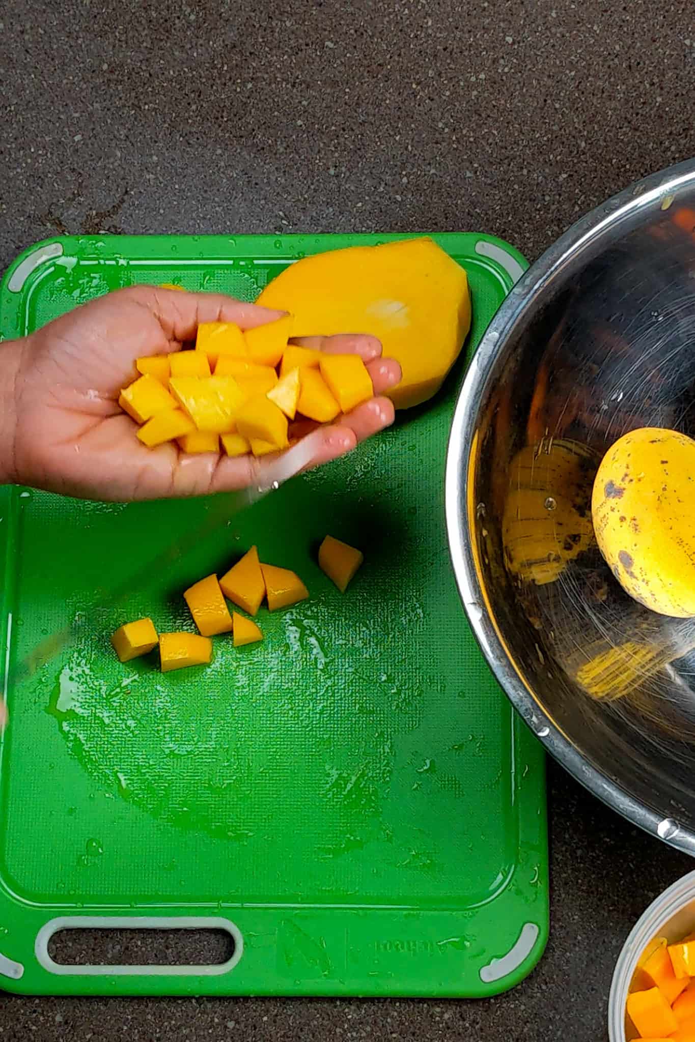 mango chucks in hand.