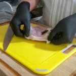 showing a fat line on the side of chicken thigh.