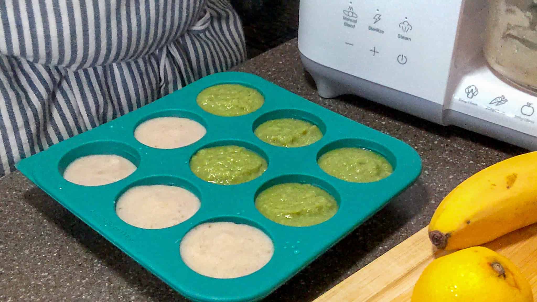 Broccoli and banana puree individually portioned in an Anytime Freezer Trays .