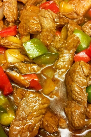 Chinese pepper steak recipe with red wine, hoisin sauce, bell peppers, and mushrooms.