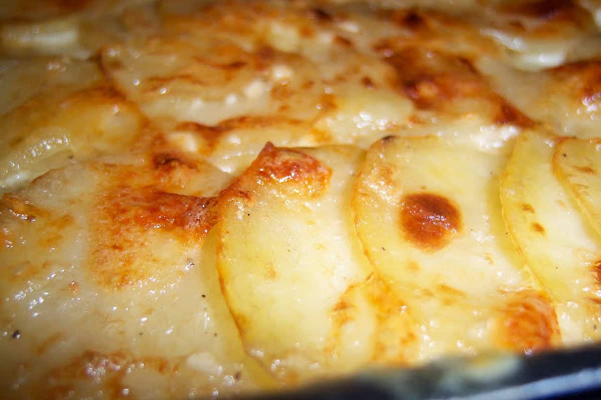 golden brown crusted baked potato au gratin, which are sliced peeled potatoes baked in creamy cheesy sauce.