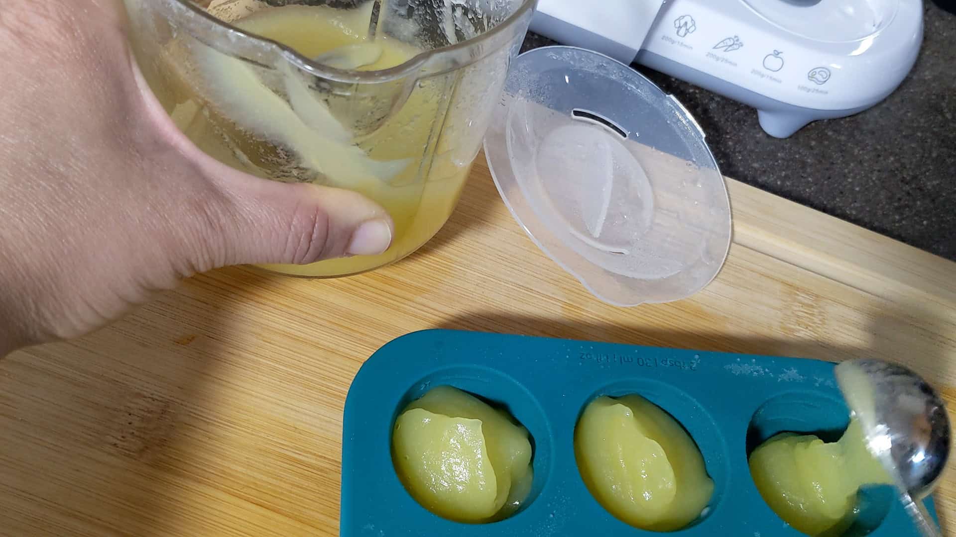 apple puree baby food portioned in an Anytime Freezer Trays .