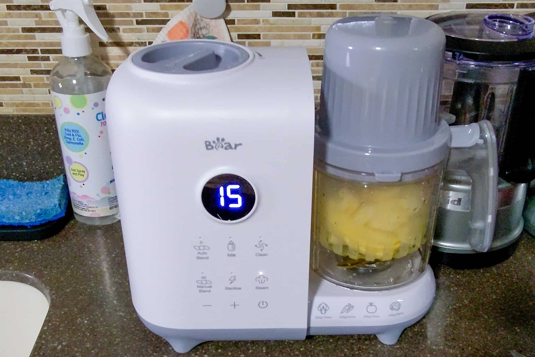 apple chunk steaming in the bear baby food maker.