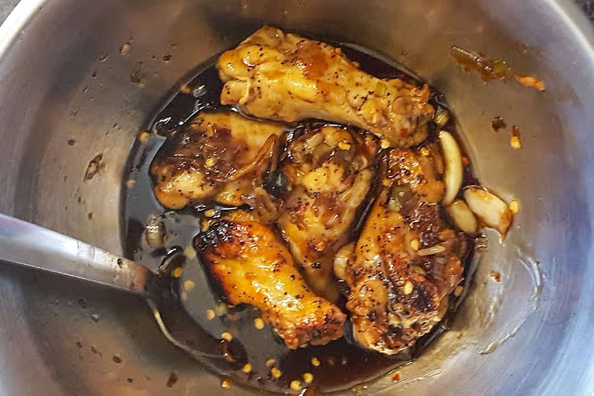 Chicken drumettes coated in dark soy ginger sauce.