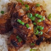 Soy ginger chicken drumettes over jasmine rice with sliced scallions.